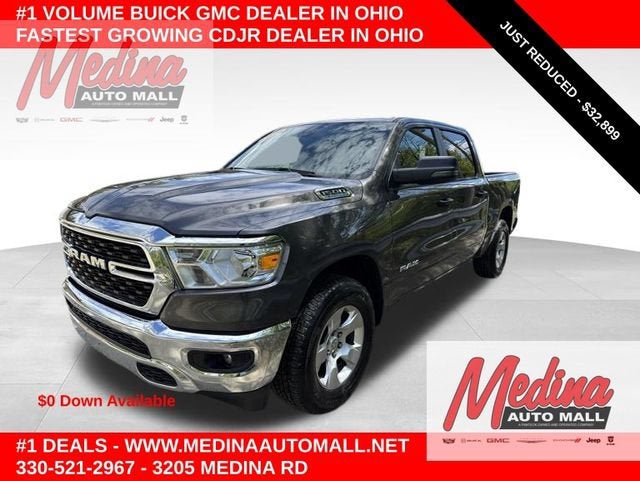 2024 RAM 1500 Big Horn in Pau Granite Cry — front three-quarter view