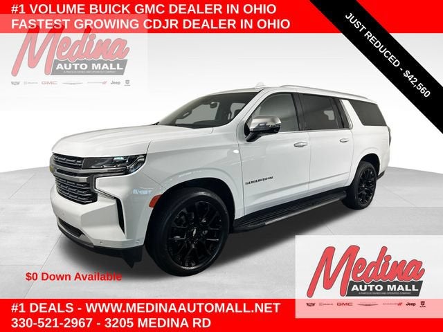 2023 Chevrolet Suburban Premier in Summit White — front three-quarter view